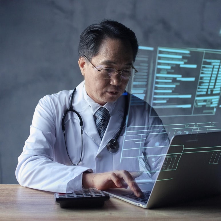 Firefly A medical professional calculating the word count on laptop monitor 