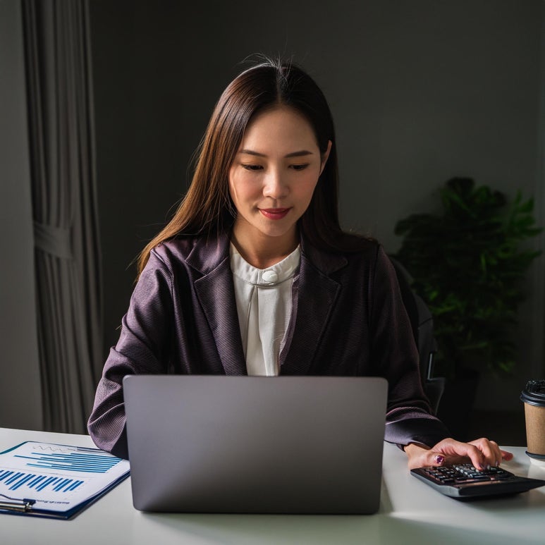 Firefly A accountant calculating the word cound on laptop monitor 92688