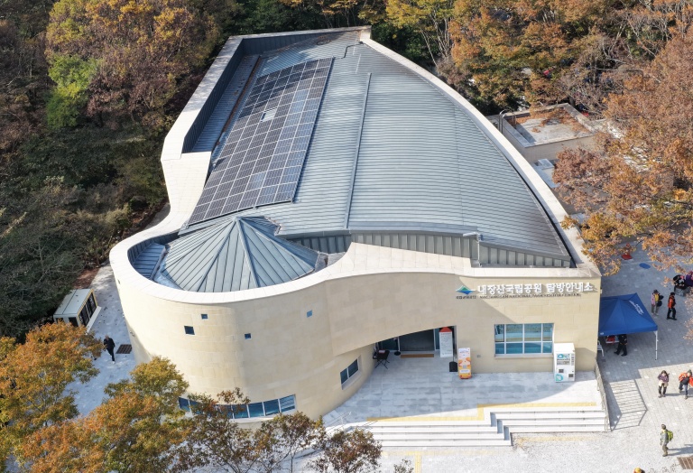 An aerial view of the Naejangsan National Park visitor centre, surrounded by forest.