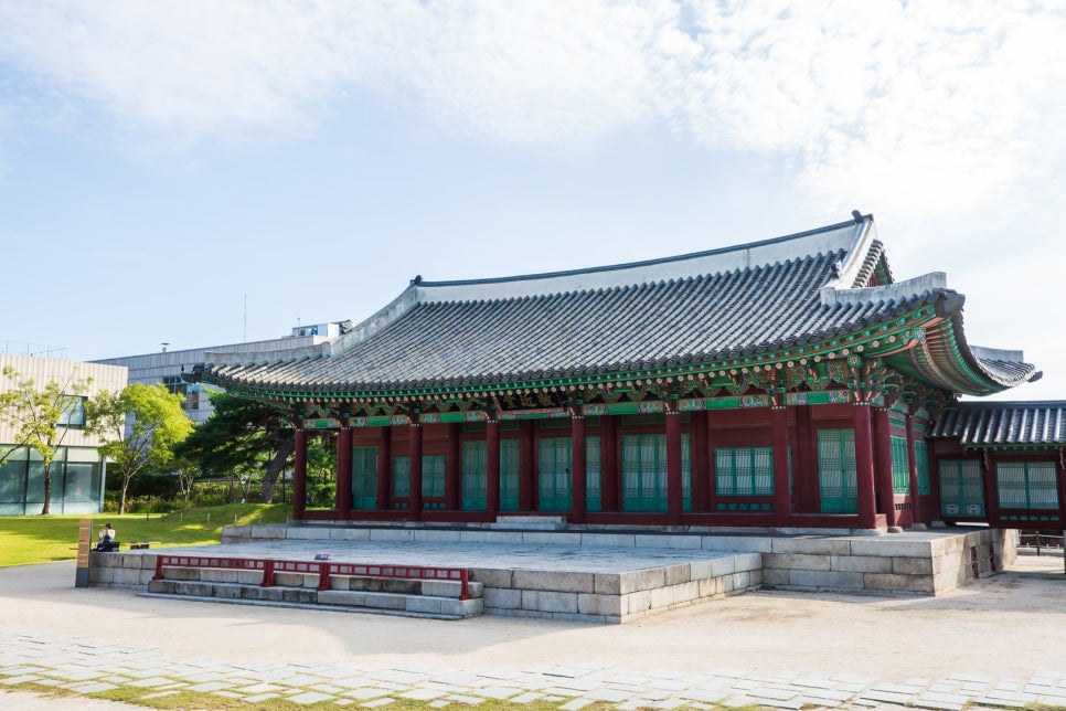 The Jongchinbu courtyard, with the modern buildings of central Seoul rising behind the hanok halls.