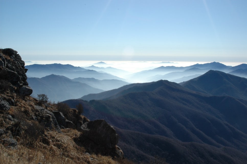 A sea of cloud filling the valleys below Nogodan in Jirisan National Park, with distant ridgelines rising through it like islands