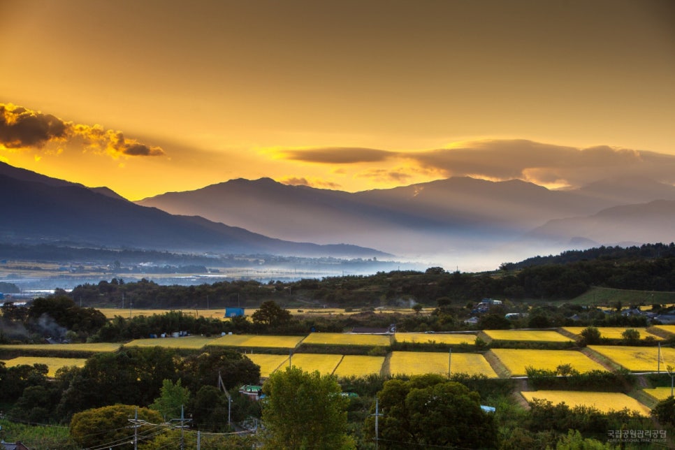 Jirisan ridges at sunset above farmland