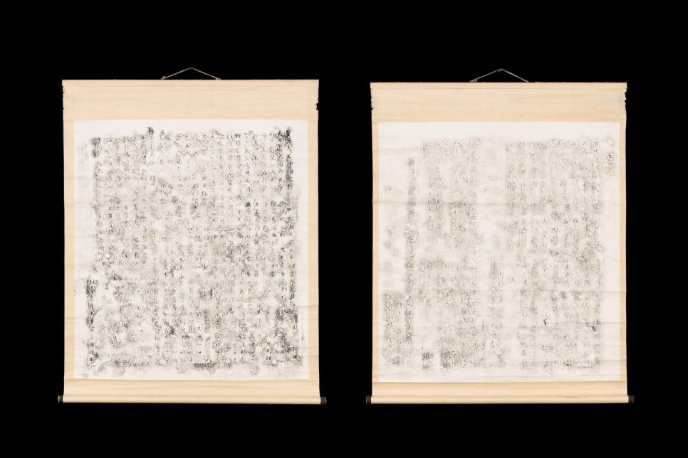 Two hanging scrolls of an ink rubbing taken from the bell's inscription, packed with vertical columns of Chinese characters