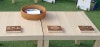 Close-up of three wooden blocks carved with weed shapes