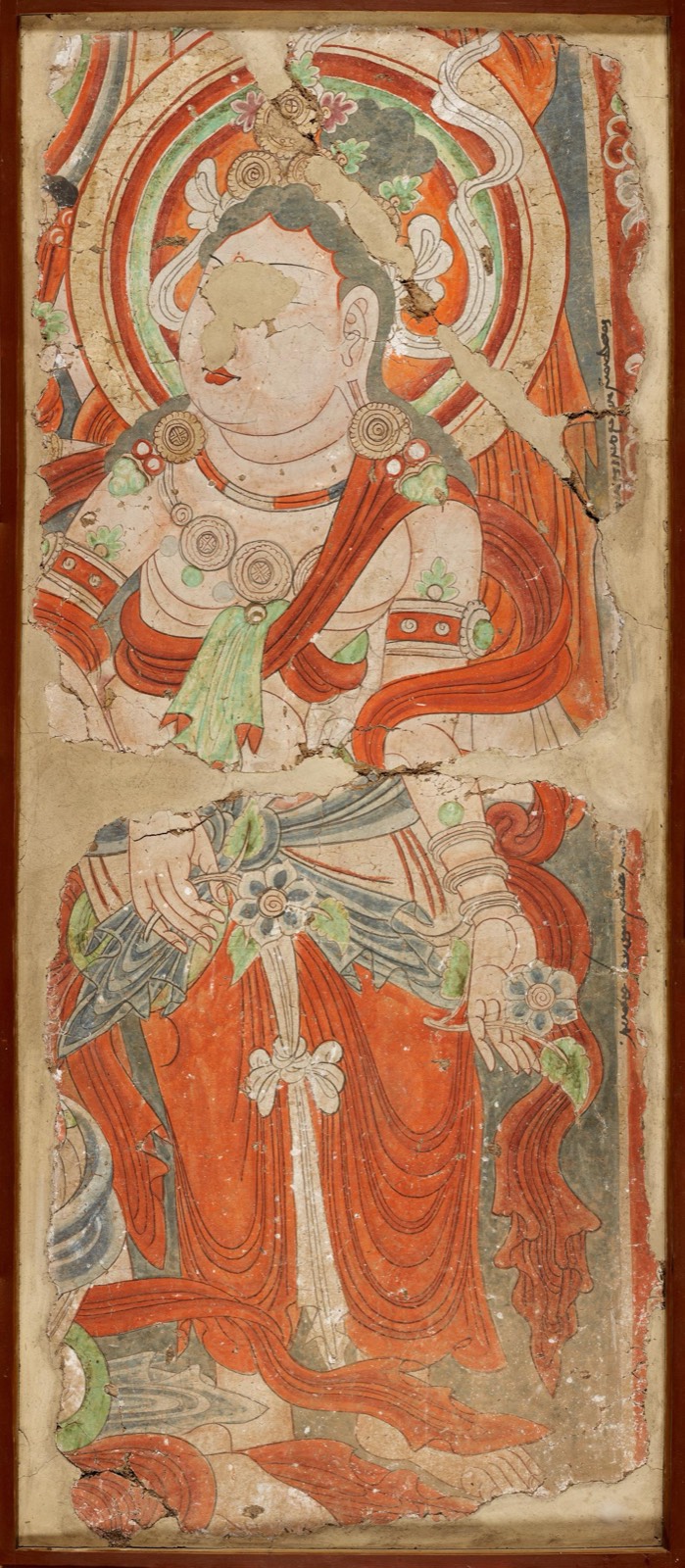 Tall Bezeklik cave mural with the Buddha and figures making offerings