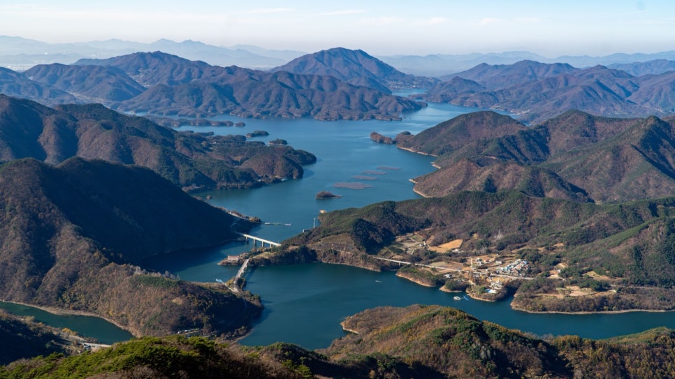 Late-autumn slopes of Woraksan falling away to Chungju Lake
