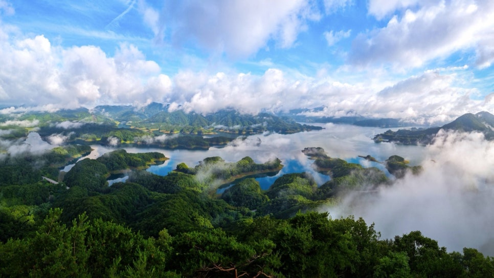 Only the tips of the Crocodile Island ridges showing above a sea of cloud on Chungju Lake