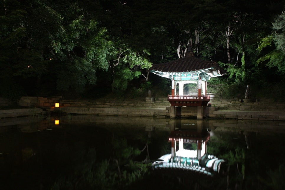 Aeryeonjeong pavilion lit at night and reflected in the pond